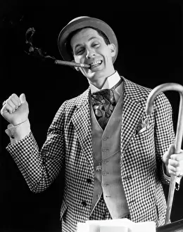 Flam: Smiling Man Carnival Barker Con Man in Checkered Suit with