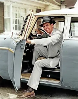 Manly: Smiling Man Commuter in Hat Suit Tie Looking at
