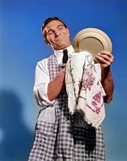 Wipe: Smiling Man Husband in Apron Washing and Drying