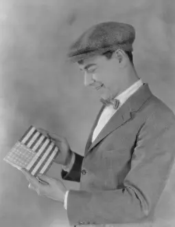 Newsboy: Smiling man looking at flag