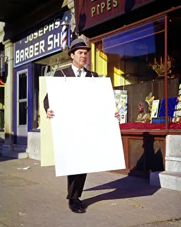 Networking: Smiling Man Walking in Suit Tie and Hat Carrying