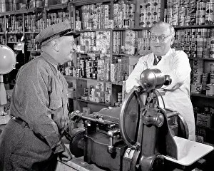 Slicer: Smiling Man in Workman'S Uniform Talking To Grocer
