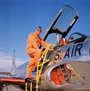 Del002: Smiling military pilot with Lockheed T-33A Shooting Star