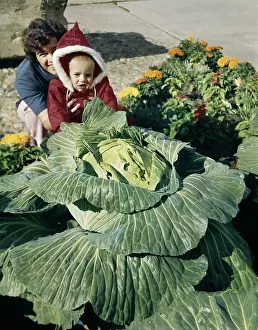 Freaky: Smiling Mother and Child Red Parka Looking at