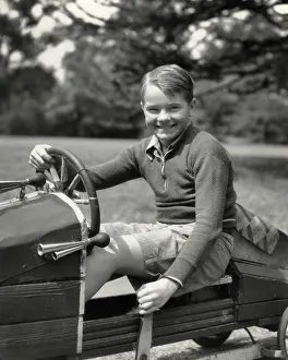Preteen: Smiling Preteen Boy Looking at Camera Sitting