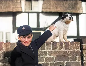 Barnabys: A smiling schoolboy and his terrier dog
