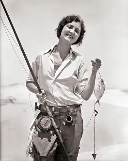 Sinker: Smiling Woman Looking at Camera Holding up Her