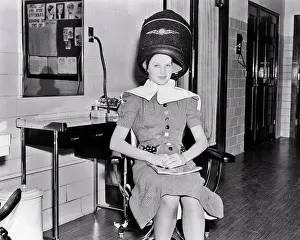 Beautician: Smiling Woman looking at Camera Sitting Under