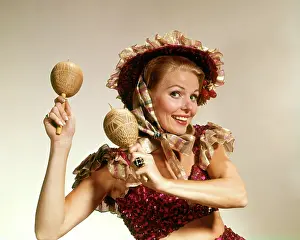 Maracas: Smiling Woman Looking at Camera Wearing Frilly