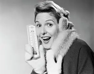 Mittens: Smiling Woman Looking at Camera in Winter Cold Holding The