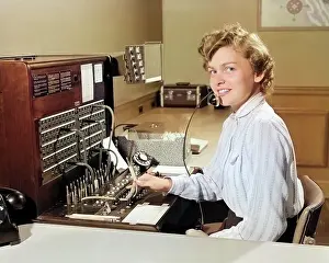 Networking: Smiling Woman Office Telephone Switchboard Operator