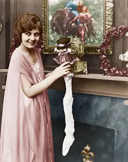 Nightgowns: Smiling woman stuffing Christmas stocking