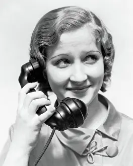 Winsome: Smiling Woman Talking on Telephone