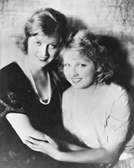 Closeness: Two smiling women holding on to each other