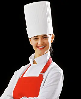 Del003: Smiling Young Woman Chef Looking at Camera