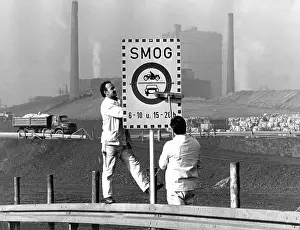 Smog: Smog sign in front of industrial scenery