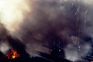Erupt: Smoke and flames erupt from an explosion