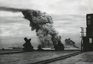 Bsloclcgr: Smoke from a merchant ship bombed in an Allied