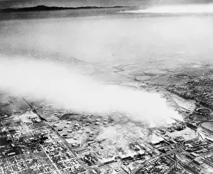 Drifts: Smoke from an oil refinery drifts across ?