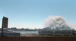 Lcgr1507: Smoke and pulverized building debris rise from the