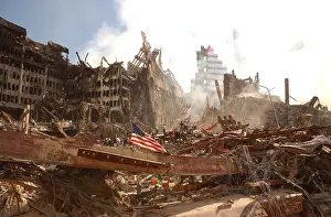 Act Of War: Smoke rises from the World Trade Center's collapsed