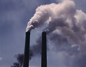 Smog: Smoke stacks were a symbol of industrial ?