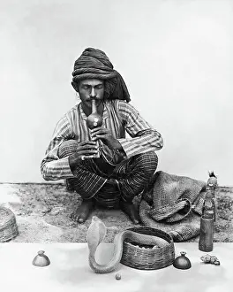Hypnotic: Snake charmer with snake, India