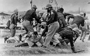 Cringes: SNCC leader John Lewis (light coat in center) ?
