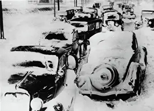 Snowed: Snowed into cars on a road toward