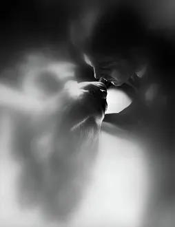 Seduce: Soft-focus couple kissing