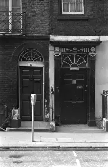 Shabby: Soho, London - two front doors with fanlights