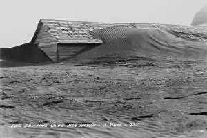 Recessions: Soil drifting over a farm building on a ?
