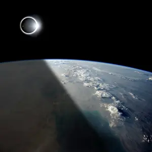 Overhead: A solar eclipses partially shades the Earth below