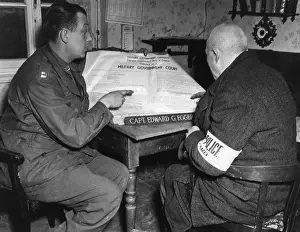 Explains: Soldier of the US Army instructing a policeman, 1945