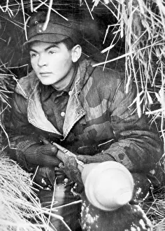 Expects: Soldier with a bazooka in position, 1945