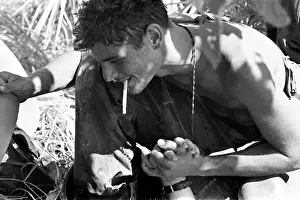 Stocktrek Images: Soldier holds the hand of a mortally wounded comrade