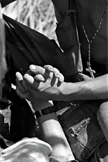 Stocktrek Images: Soldier holds the hand of a mortally wounded comrade