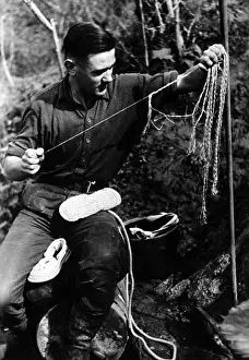 Theodor: Soldier making a bunker shoe, 1942
