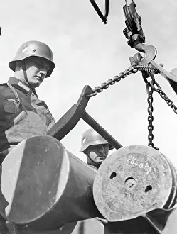 Floors: Soldier next to projectiles on a crane