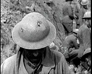 Dents: Soldier Showing the Dents In His Helmet