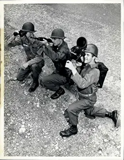 Unadorned: Three soldiers with binoculars, rifle and sniperscope