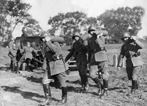 Partially: Soldiers carry ammunition for a field howitzer