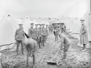 Brecon: Soldiers cleaning up at a muddy training camp