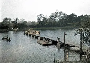 Planks: Soldiers constructing Bailey Bridge across river