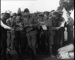 Eagerly: Soldiers Eagerly Receiving Their Copies Of