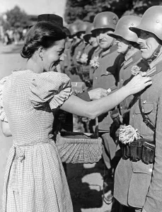 Jubilation: Soldiers with flowers, 1938