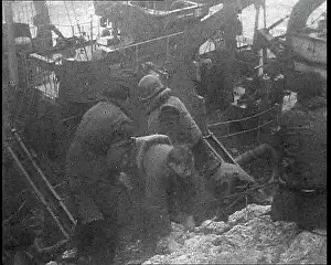 Shipwrecked: Two Soldiers Helping Another Climb From a Shipwrecked