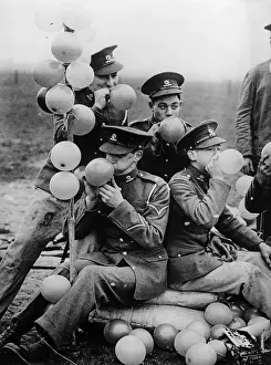 Inflating: Soldiers inflating balloons