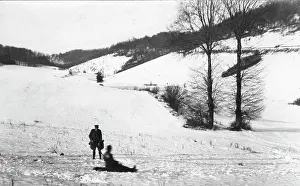 Sledging: Two soldiers playing in snow