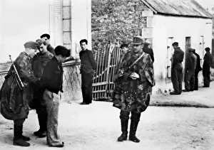 Interrogate: Soldiers searching for partisans in Brittany interrogate